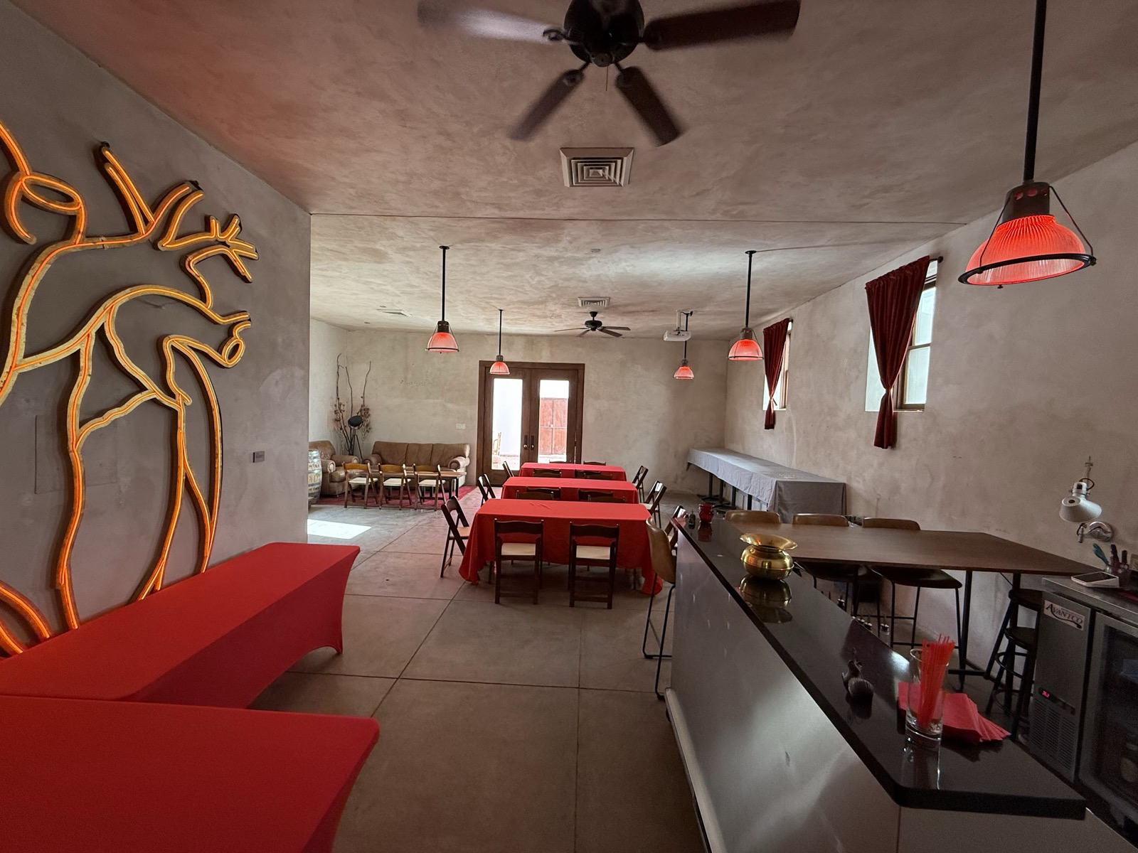 Event seating beneath the Latido de Luz art piece