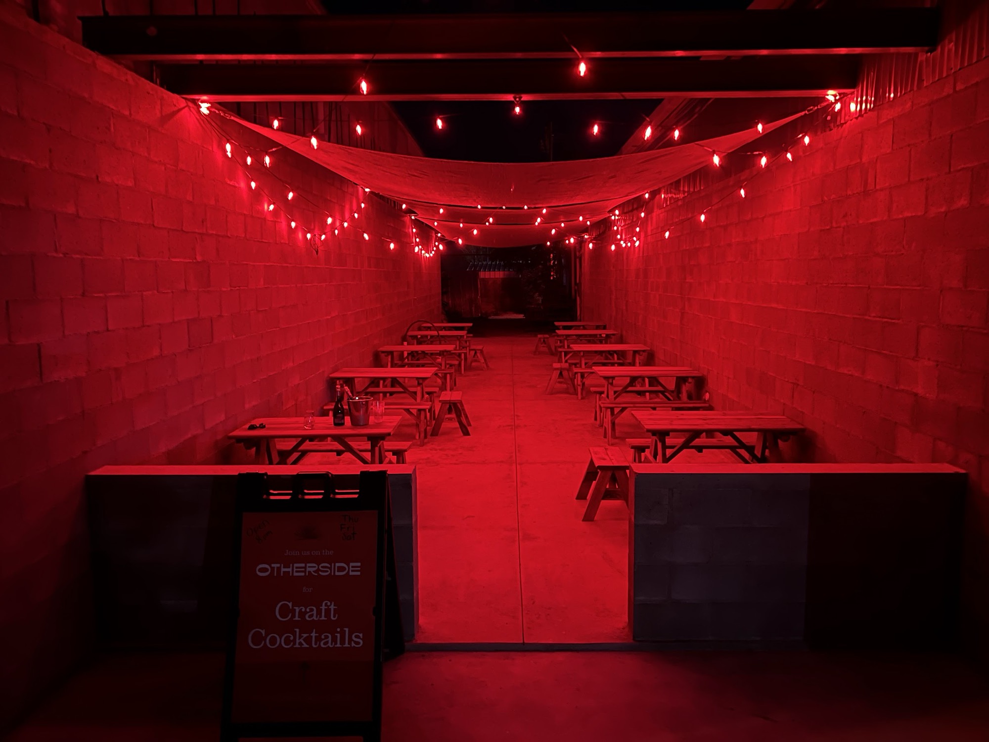 Otherside courtyard entrance at night